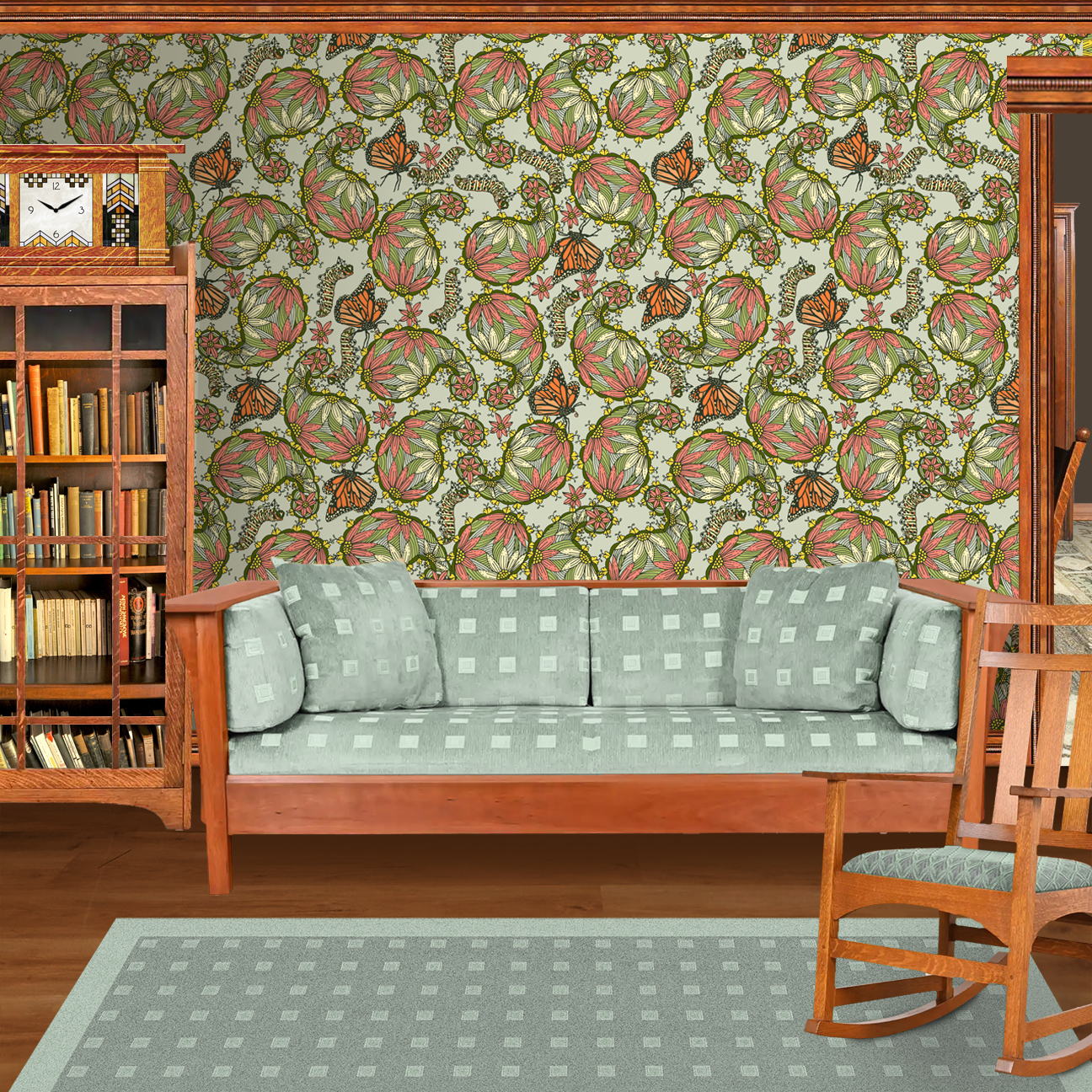 The artwork features a dense, seamless pattern composed of intricately detailed butterflies, caterpillars, and flowers. The butterflies are primarily orange with black and white accents, conveying a monarch butterfly design. The caterpillars are segmented and textured with earthy tones of green and beige, blending naturally with the floral elements. The flowers have petals colored in shades of pale pink and green, with leaves interspersed throughout the composition. The background is a light, muted yellow, which enhances the vibrant colors of the butterflies and floral motifs. The overall design is highly decorative and organic, showcasing a lyrical interplay between the stages of a butterfly's life cycle and plant life. The wallpaper design is shown in a Mission style living room